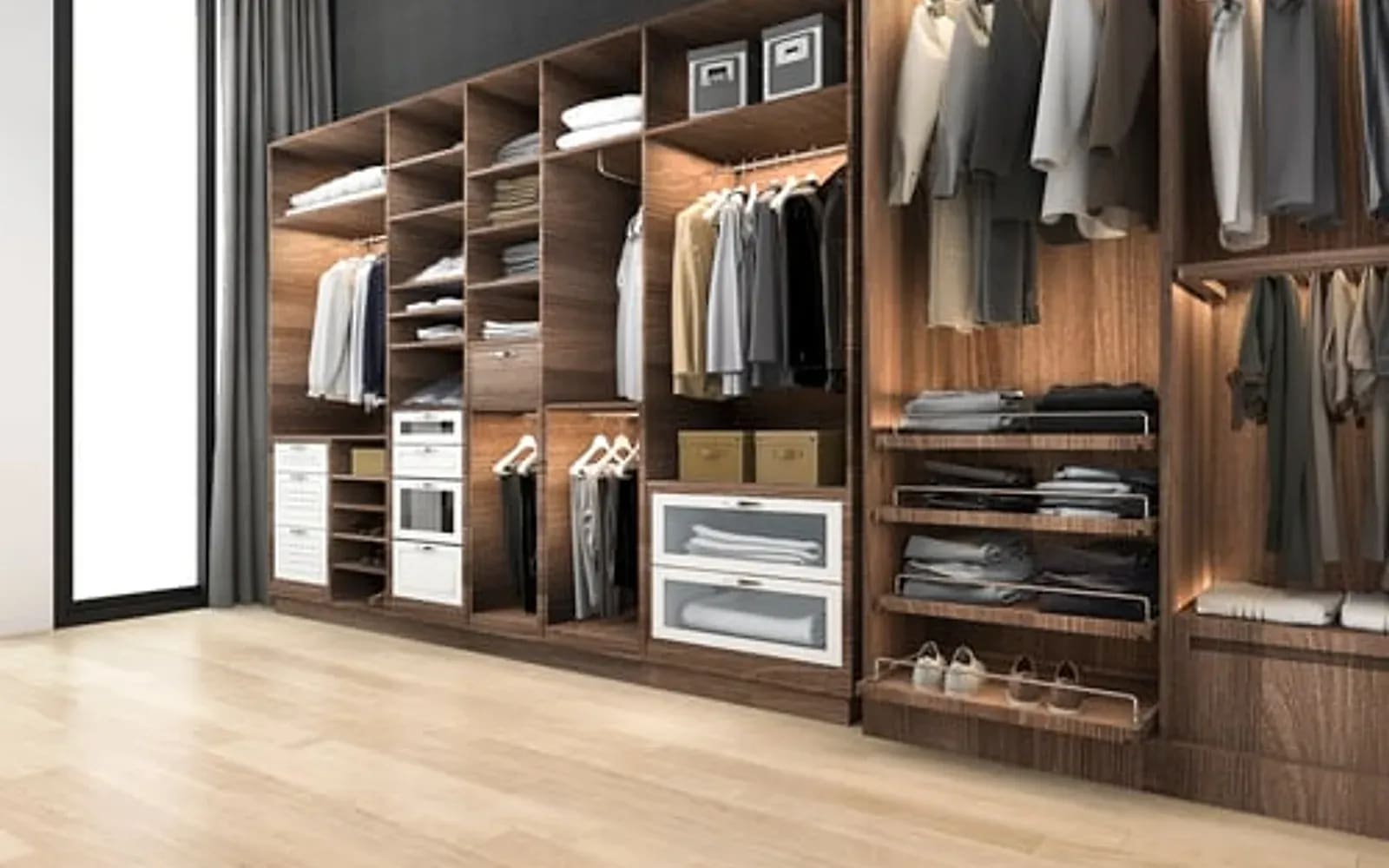 Custom warm wood walk-in closet system with integrated lighting and drawer banks