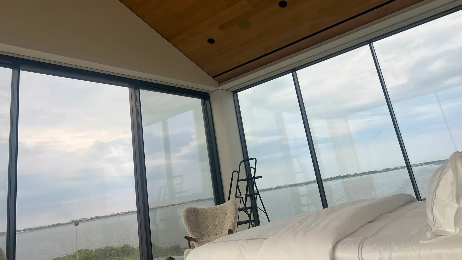 Bedroom with custom wood ceiling and built-in millwork by WP High Quality Carpentry Corp