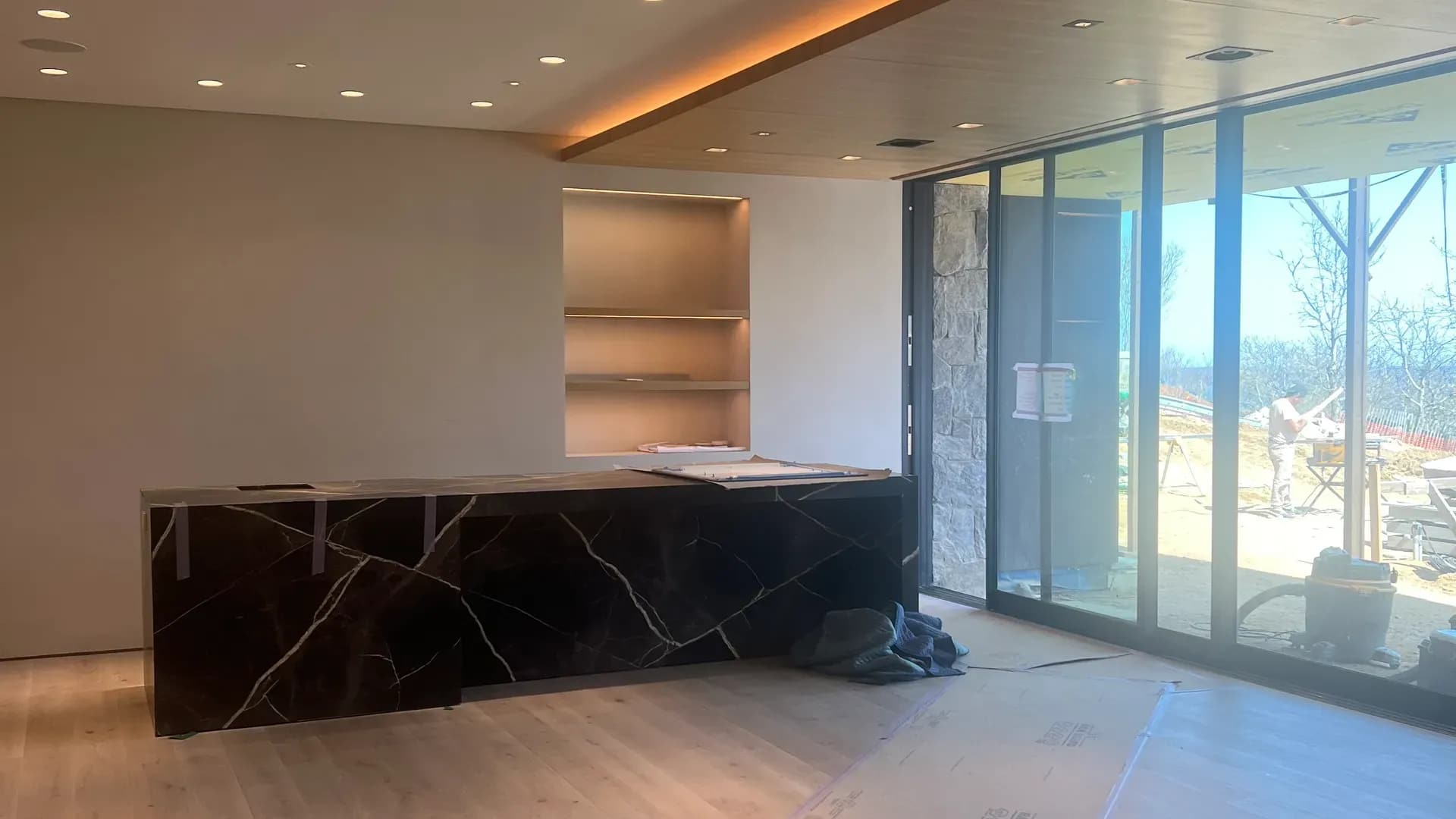 Custom carpentry and millwork in a waterfront Hamptons living room by WP High Quality Carpentry Corp